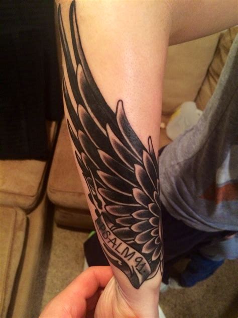 forearm wing tattoo designs.